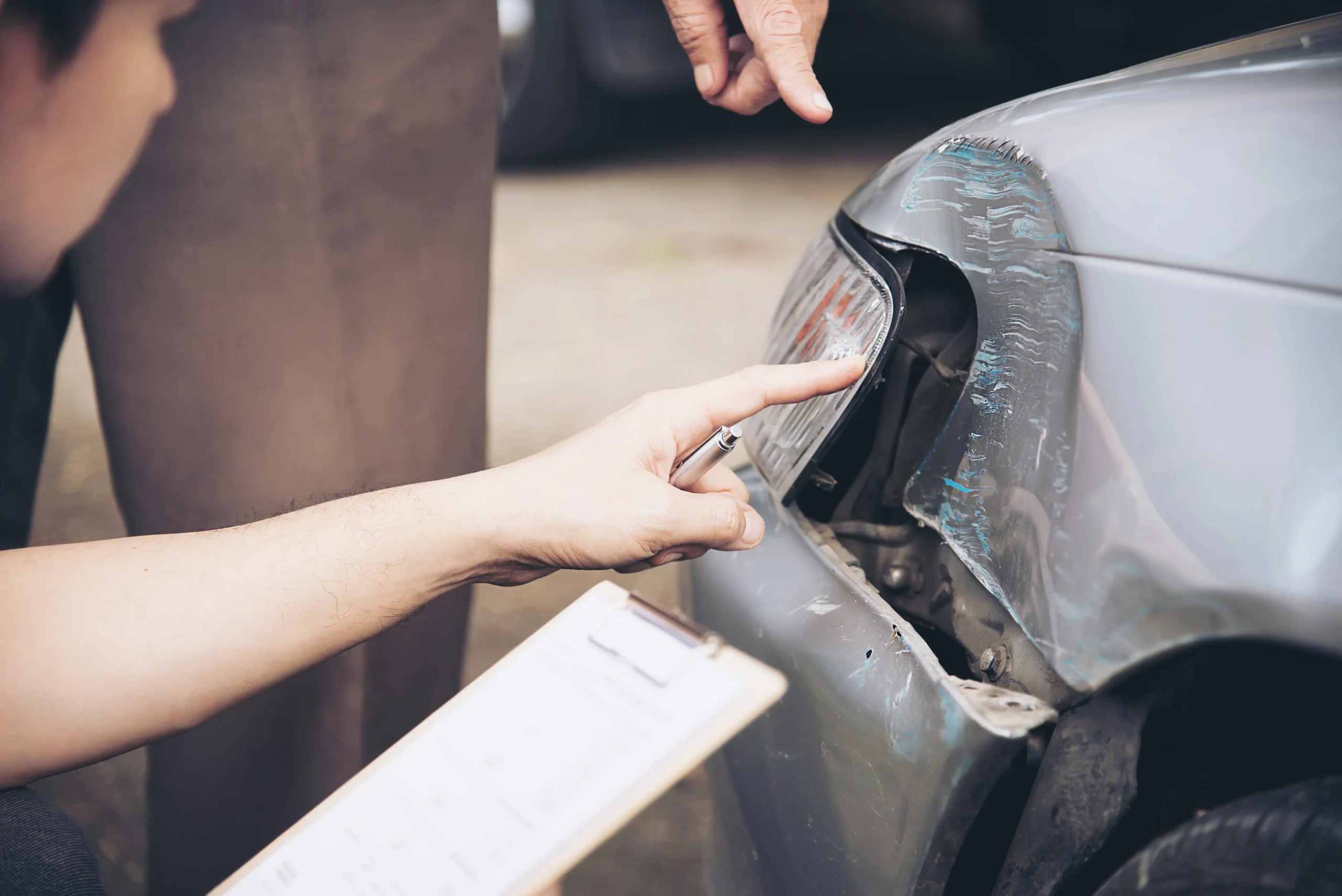 Claims adjuster reviewing accident